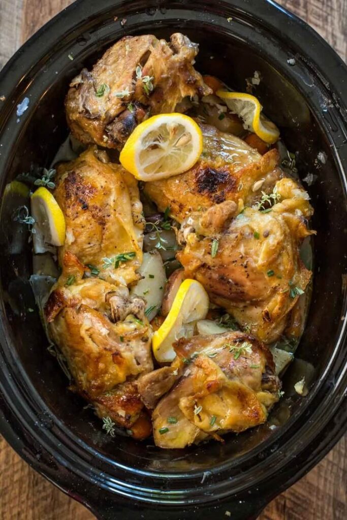 Close-up of bourbon chicken with sticky sauce and chopped scallions